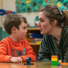 Teacher working with student